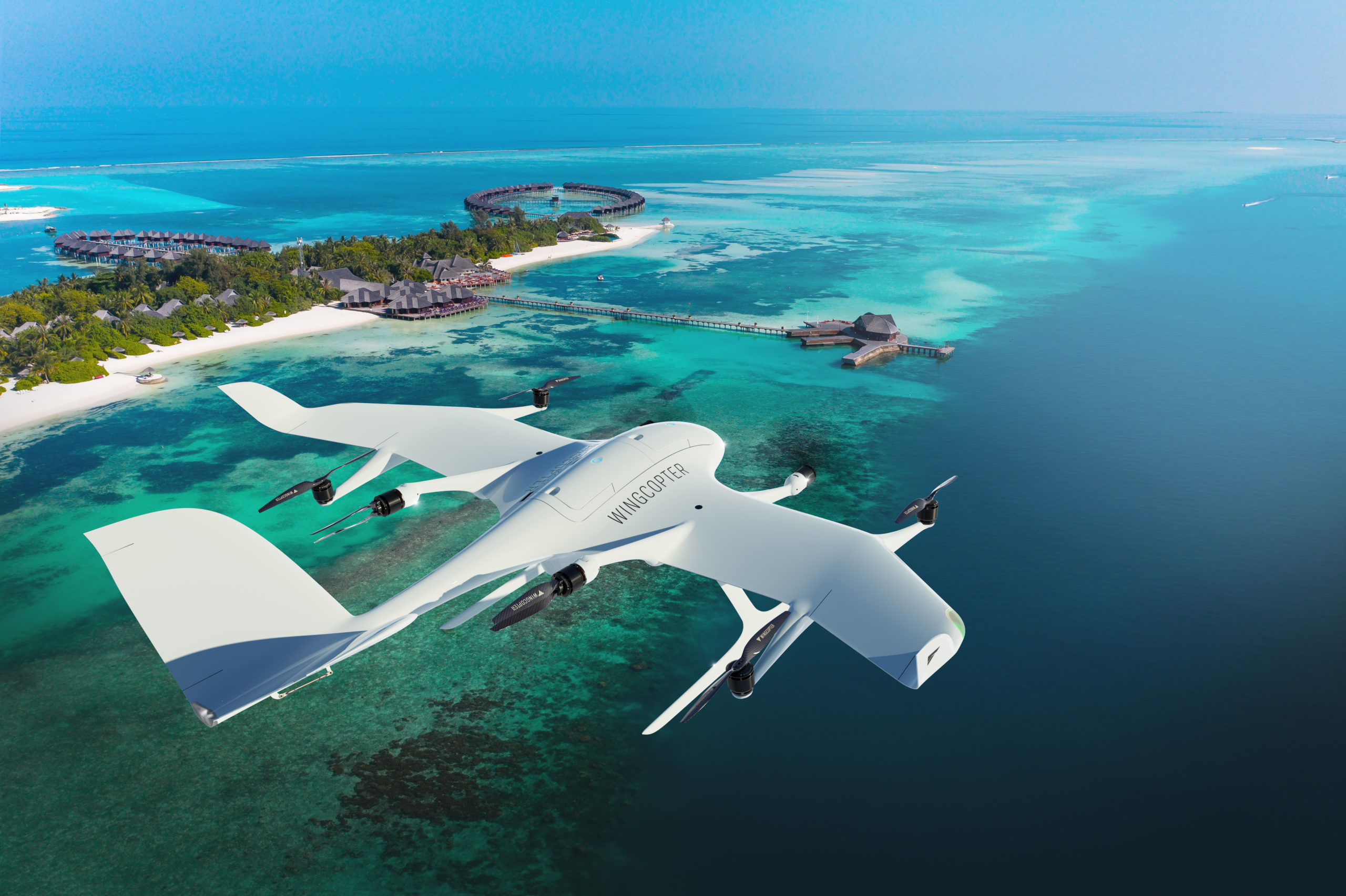 Maledives, South Male Atoll, lagoon of Olhuveli with sandy beach and water bungalow, aerial view